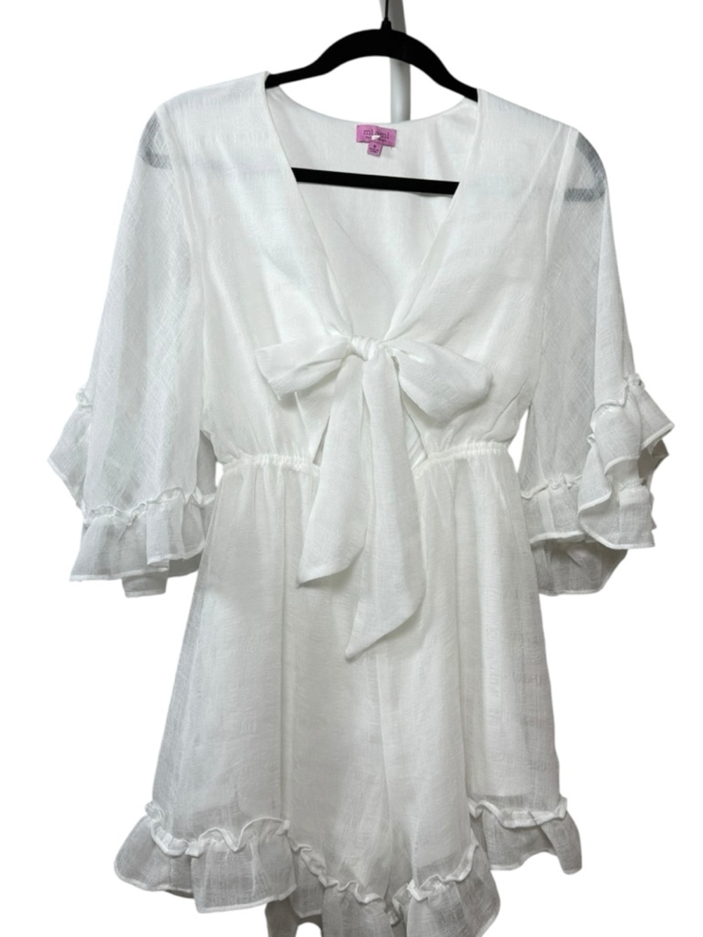 Mi Ami Woman’s. Sheer Stylish white romper size small with a tie-front detail.